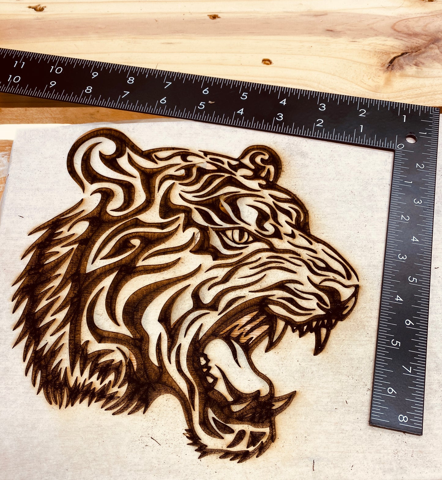 Tiger head laser engraved on plywood