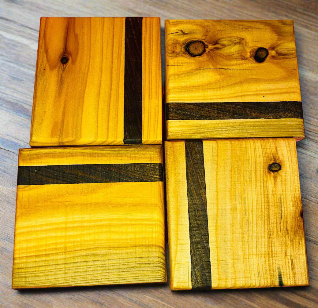 Wooden coasters with mahogany inlay.