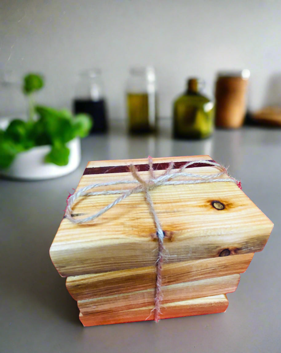 Wooden coasters with mahogany inlay.