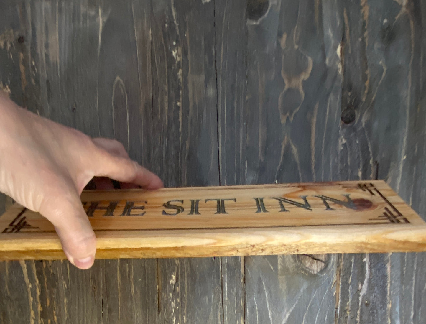 The SIT INN pub sign